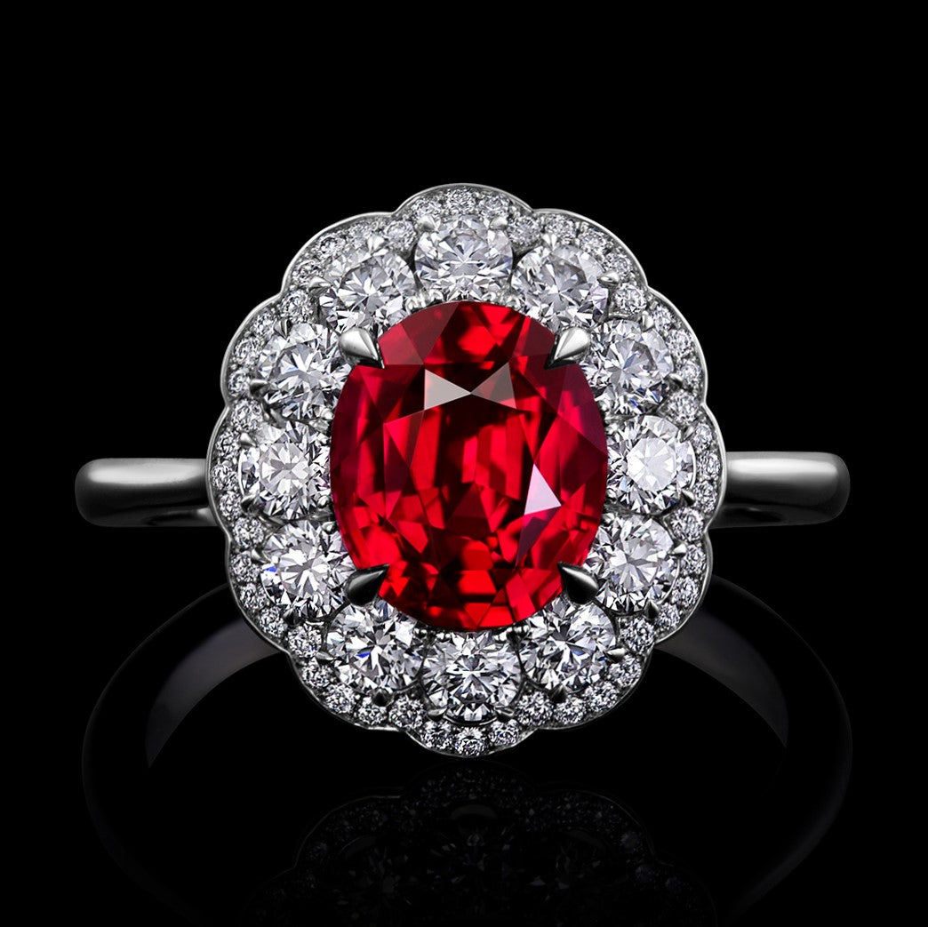 Ruby Surrounded by Diamonds and Set in a Hand Fabricated Platinum ring.