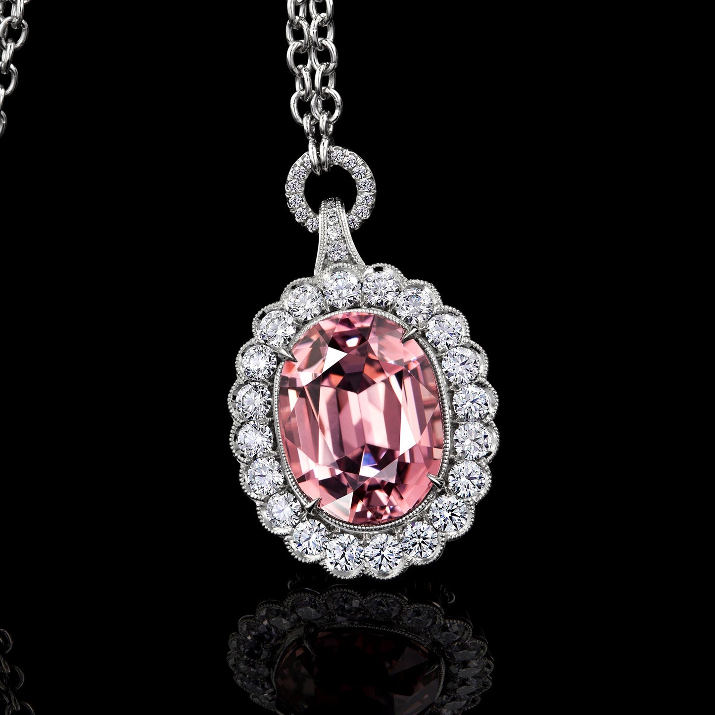 Pink Garnet Pendant Surrounded by  Platinum and Ideal Cut Diamonds.