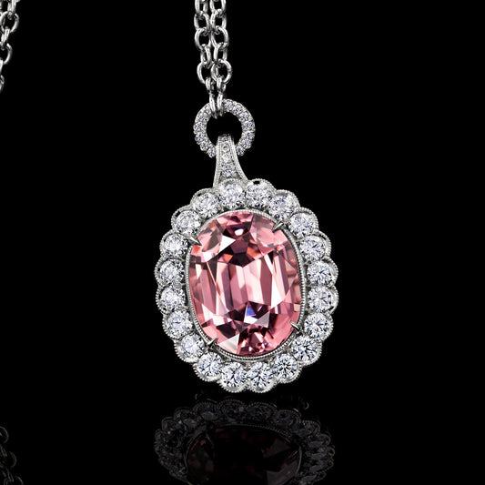 Pink Garnet Pendant Surrounded by  Platinum and Ideal Cut Diamonds.