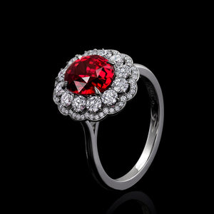 Ruby Surrounded by Diamonds and Set in a Hand Fabricated Platinum ring.