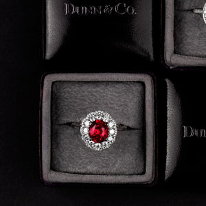 Ruby Surrounded by Diamonds and Set in a Hand Fabricated Platinum ring.